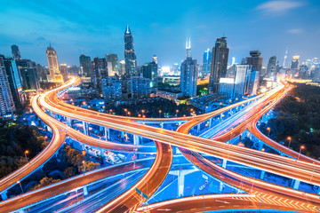 Wall Mural - city highway overpass panoramic with shanghai skyline, modern traffic background