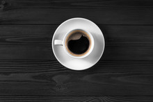 Black Coffee In White Cup On Black Wood Background