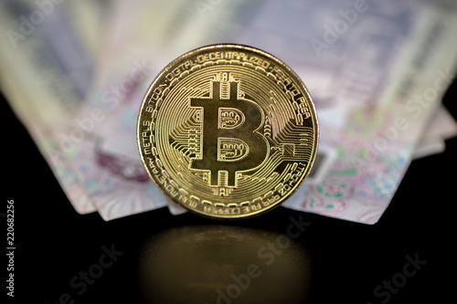 Bitcoin Token On Black With Reflection On Top Of Dubai Dirham - 
