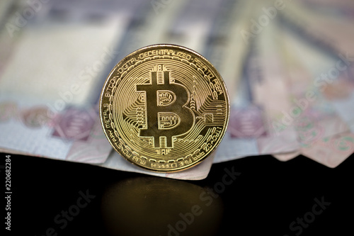 Bitcoin Token On Black With Reflection On Top Of Dubai Dirham - 