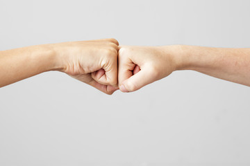 Wall Mural - Young people are fist bumping