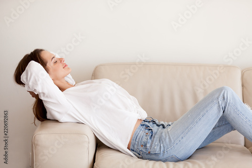 Calm Hy Millennial Woman Relaxing On Couch Breathing Fresh Air At Calm Hy Millennial Woman Relaxing On Couch Breathing Fresh Air At Home Lazy Resting