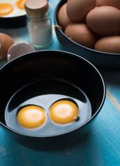 Sticker - Cracked eggs in bowl and egg shells for cooking