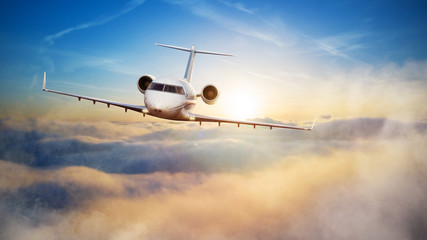 Luxury private jetliner flying above clouds