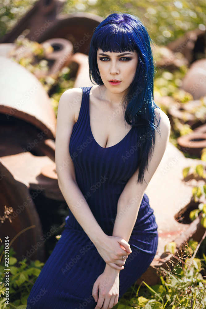 Young beautiful sensual girl with blue hair, wearing a elegant blue dress  Stock Photo | Adobe Stock