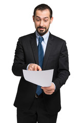 Happy businessman reading a document. Isolated on white