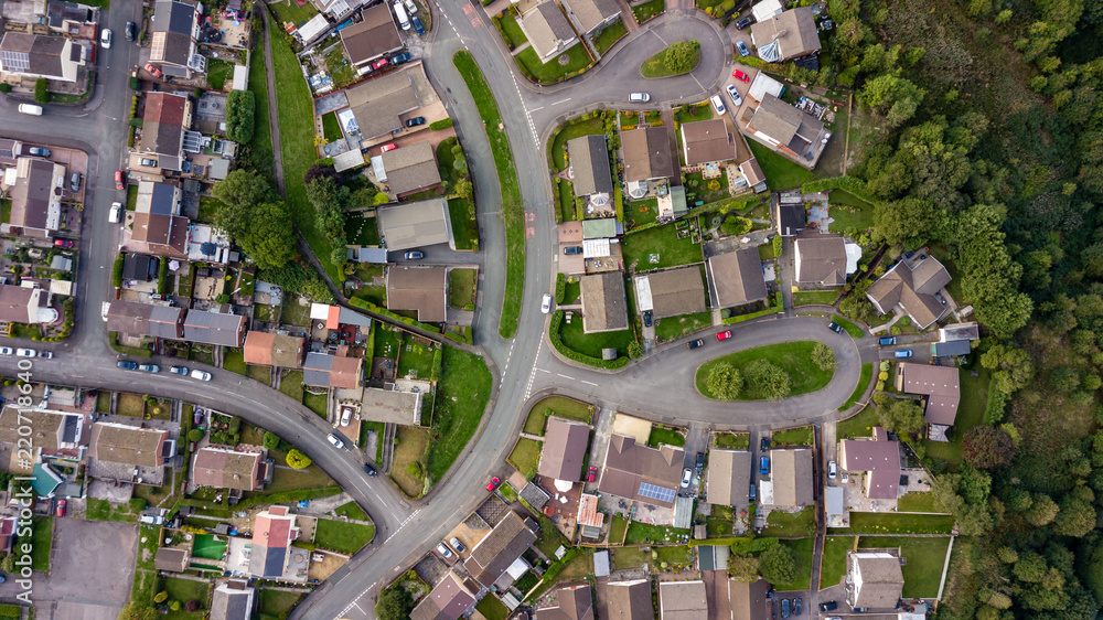 Top down aerial view of urban houses and streets in a residential area of a Welsh town - obrazy, fototapety, plakaty 