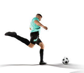 Wall Mural - soccer player kicking the ball in the isolated on white