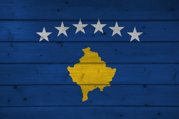 Wall Mural - Flag of Kosovo on wooden background, surface. Wooden wall, planks. National flag.