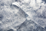 Fototapeta Tęcza - The texture of the ice. The frozen water.Winter background   
