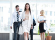 © ASDF - modern business woman walking in the spacious lobby