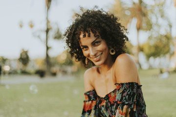 Wall Mural - Beautiful woman posing in the park