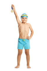 Wall Mural - Little boy swimmer holding a gold medal