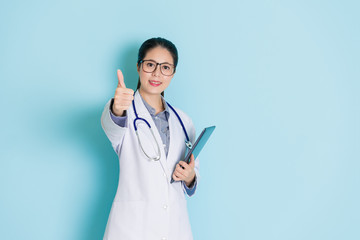 Wall Mural - femal medical showing a thumbs up