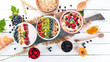 Large Assortment of porridge with fruit and berries. Breakfast. On a white wooden background. Top view. Free space for text.