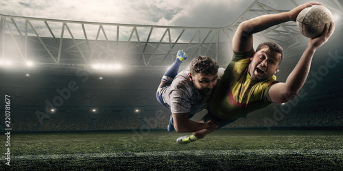 Obrazy Rugby  dwoch-mezczyzn-rugby-walczy-o-pilke-w-locie-na-profesjonalnym-stadionie-rugby