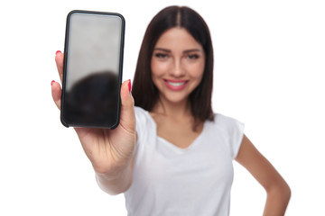 casual woman in white t-shirt shows mobile phone screen