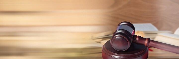 Gavel in front of books of law information with transition