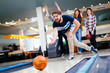 Leinwandbild Motiv Friends having fun while bowling