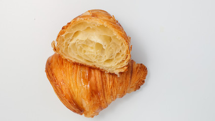 Wall Mural - Freshly baked traditional croissant cut into two parts