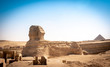 Panoramic view of the full profile of the Great Sphinx with the pyramid in the background in Giza. Egypt.