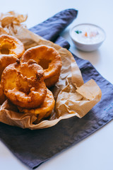 Yorkshire pudding with smoked salmon and sour cream on baking paper