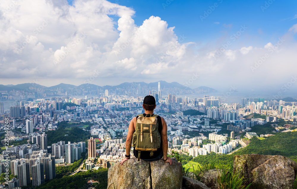 Man enjoying Hong Kong view from the Lion rock - obrazy, fototapety, plakaty 