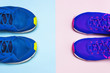 Blue mens and violet-pink female sneakers on pastel pink and blue background flat lay top view with copy space. Sports shoes, fitness, concept of healthy lifestile, everyday training.