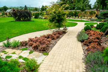 A country house with a beautiful backyard behind the house, landscape design