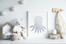 Stylish Scandinavian Newborn Baby Room With Toys,  Rabbit, Cotton Lamps And Star. Modern Interior With Mock Up Photo Frame.