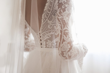 beautiful wedding dress and white bow isolated on white background