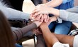 © BillionPhotos.com - Close-up view of group of people stacking hands