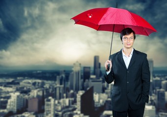 Wall Mural - Portrait of  businessman with umbrella on background