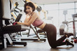 © itchaznong - Attractive fit woman relaxing after workout in gym fitness. Portrait sport and Healthy concept.