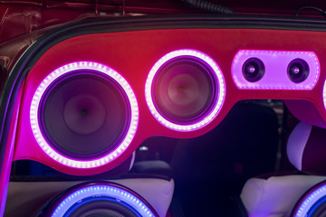 Wall Mural - colorful lights of stereo and speakers in car in the night