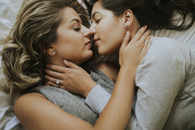 Lesbian Couple Kissing In The Morning