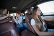 © ASDF - mom with her kids in the family car