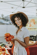 © Rawpixel.com - Woman buying tomatoes at a farmers market