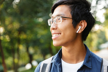 Canvas Print - Close up image of Smiling asian male student in eyeglasses