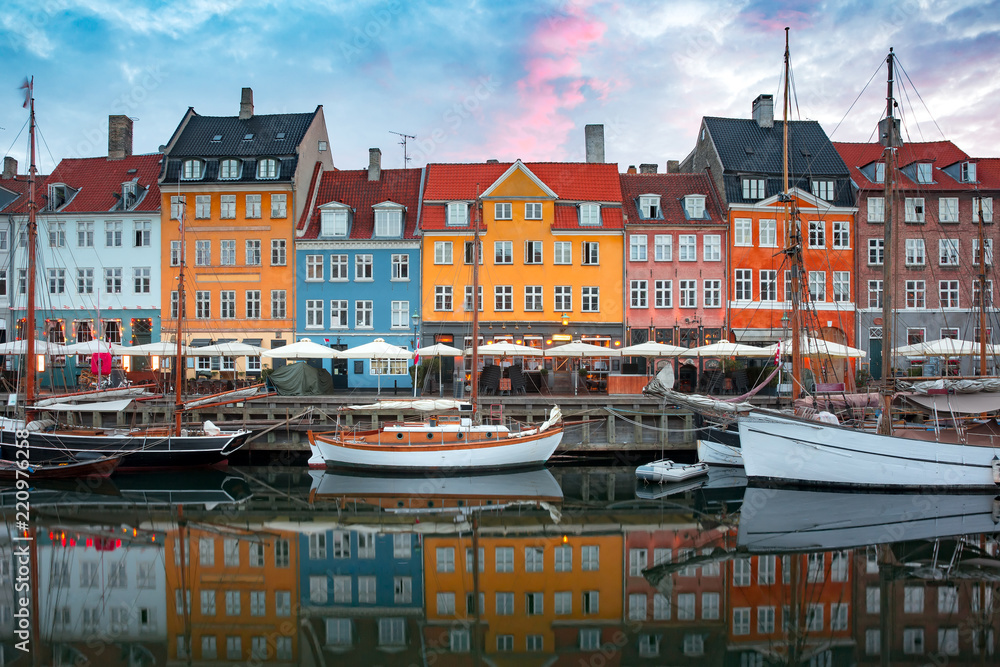 Nyhavn at sunrise, with colorful facades of old houses and old ships in the Old Town of Copenhagen, capital of Denmark. - obrazy, fototapety, plakaty 