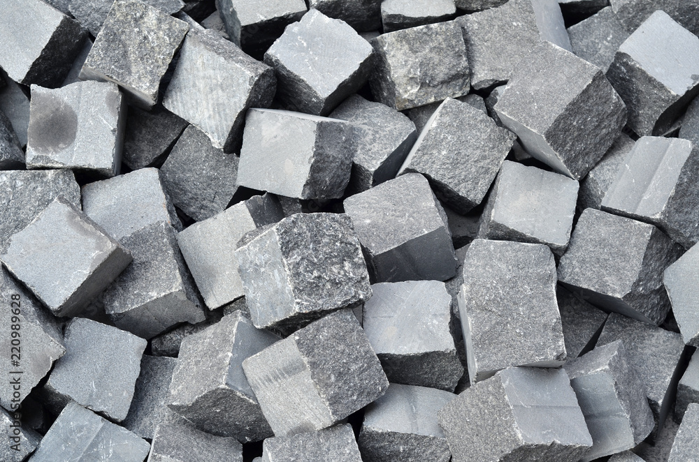Granite chipped gray paving slab. Dropped into a bunch Stock Photo ...
