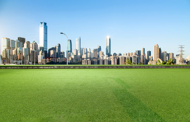 Sticker - The square with lawn and the modern city skyline are in Chongqing, China.