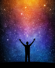 Wall Mural - Man silhouette on a night sky background with bright stars. Man watching the stars. Science, education and religion team concept background. Elements of this image furnished by NASA.