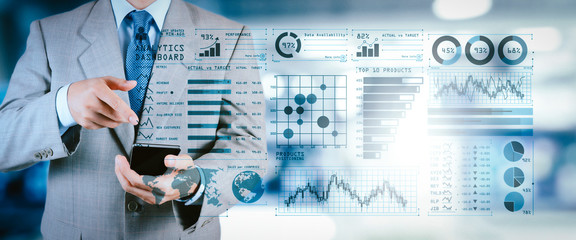 Poster - Intelligence (BI) and business analytics (BA) with key performance indicators (KPI) dashboard concept.business documents on office table with smart phone and digital tablet and graph