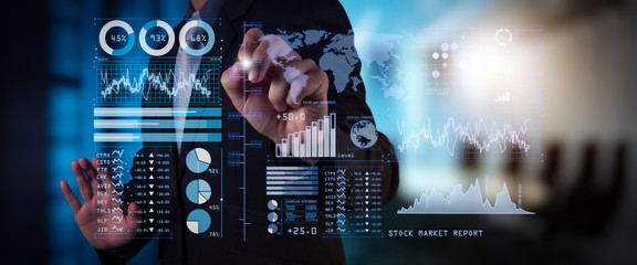 Investor analyzing stock market report and financial dashboard with business intelligence (BI), with key performance indicators (KPI).businessman hand working with finances program 