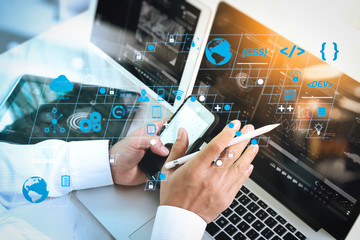 Team work concept,businessman hand attending video conference in modern office.Digital tablet laptop computer design smart phone using. Sun effects