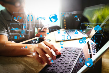 Wall Mural - outsource developer working on marble desk working laptop computer mobile application software and d
