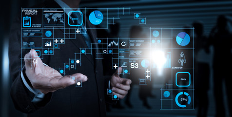 Poster - Businessman hand working with a digital tablet on meeting room background