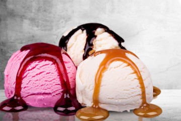 Poster - Scoops of ice cream with syrup on background