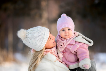 Beautiful Mother and daughter winter portrait 